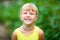 Little girl laughing and showing her teeth