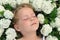 Little girl laying in flowers - snowball