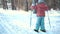 A little girl is learning cross country skiing