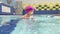 Little girl learning to swim in the pool, kids playing sports