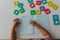 Little girl learning to write letters, home learning