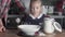 A little girl learns to cook with her mother