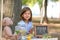 Little girl at lemonade stand in park