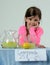 Little girl at lemonade stand waiting for customer