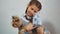 Little girl lifestyle holding a cat in her arms. kosh and girl pet friendship care and love. children and pets cat