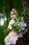 Little girl with lilac bouquet