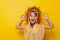 Little girl in lion costume roaring