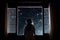 Little girl looking out window into starry night sky, Generative AI