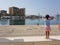 Little girl looking at the Port of Malaga