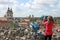 Little girl looking through sightseeing binoculars on Eger