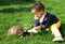 Little girl lovingly feeding her tortoise with a banana