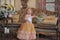 Little girl in the lush yellow with white dress