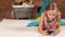 Little girl lying and texting on the phone
