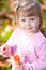 Little girl making bubble blower on the autumn forest