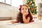Little girl making christmas wish list at home