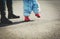 Little girl making first steps with mothers help