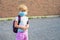 Little girl in mask during corona virus going to school or kindergarten