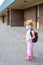 Little girl in mask during corona virus going to school or kindergarten