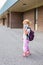 Little girl in mask during corona virus going to school or kindergarten