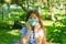 Little girl with mask, pretty girl with medical mask in park