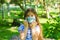 Little girl with mask, pretty girl with medical mask in park