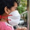 Little Girl in medical mask staying at home under quarantine - stock photo, Isolation Quarantine Corona virus Covid 19