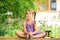 Little girl meditating outdoors. Relaxation