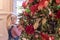 Little girl mesmerized by beautiful Christmas tree