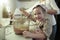 Little girl mixing dough for a birthday cake