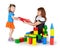 Little girl with mother playing with blocks