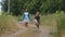 Little Girl with Mother Walking on a Country Road