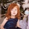 Little girl. New Year xmas child. Christmas eve holiday. interior. interior. Red hair. Horizontal