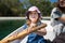 Little girl paddling in a boat