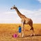 Little girl painting giraffe into many colors