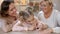 Little girl painting grandmother nails doing manicure, female beauty, leisure