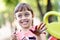 Little girl painting with paintbrush and colorful paints