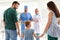 Little girl with parents visiting children`s doctors