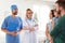 Little girl with parents visiting children`s doctors