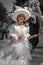 Little girl in period costume in Venice. Black and white, color on the little girl.