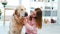 Little girl petting golden retriever dog