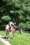 Little girl petting a horse while horseback riding