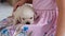 Little Girl Petting Labrador Puppy on her Knees