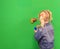 Little girl with pig tails playing with lego wall at library