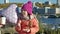 Little girl in a pink hat with a balloon in the river port, dines, close-up