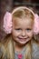 Little girl in pink headphones