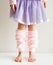 Little girl in pink leg warmers