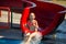 A little girl in a pink swimsuit slides down a water slide in a water park during the summer holidays.Greece