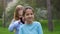 Little girl Plaits the Braid Of Her girlfriend. concept of friendship relationships