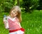 Little girl with plastic bottle of mineral water