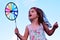 Little girl play with pinwheel toy windmill